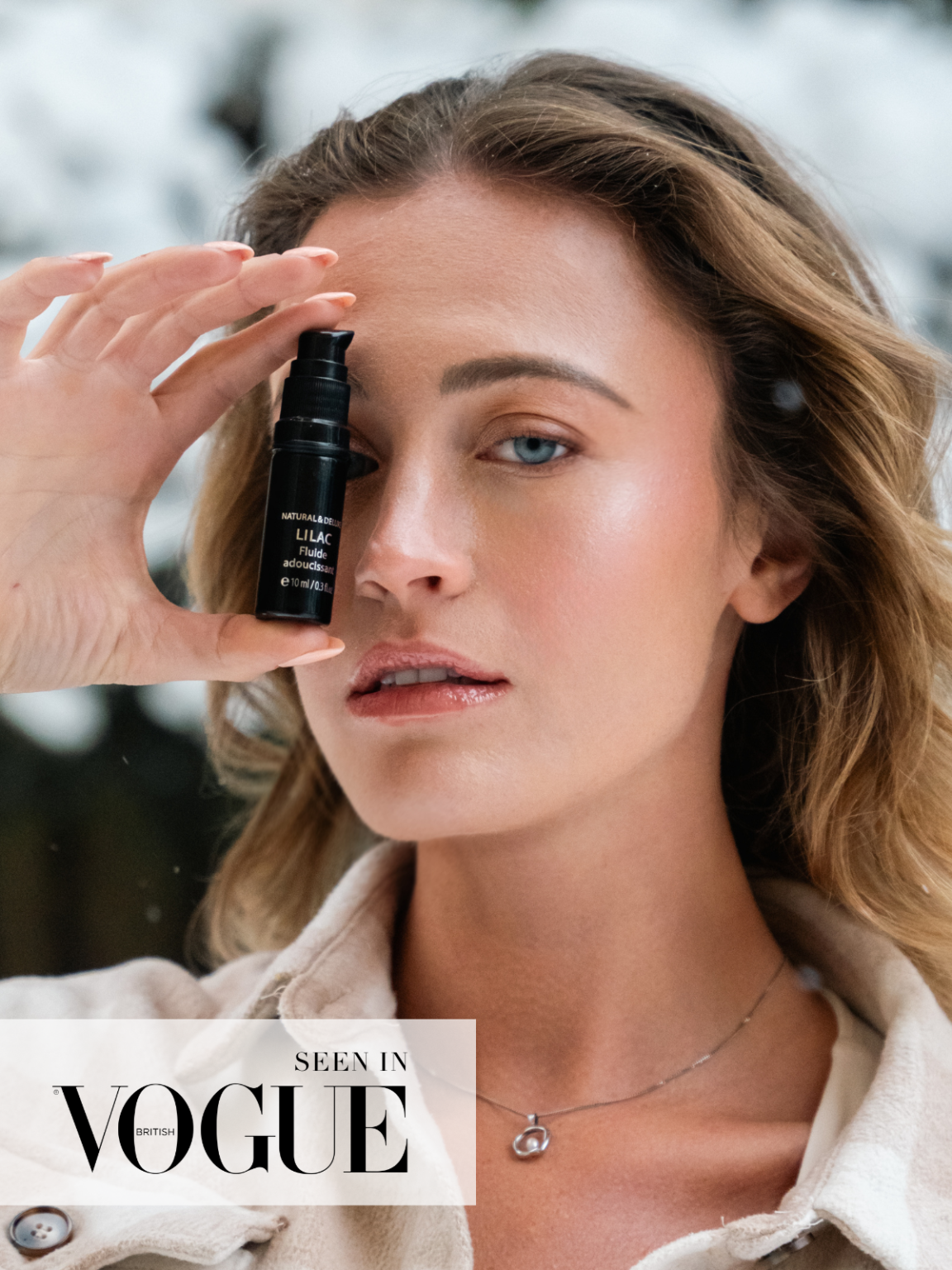 Bottle of Lilac Ritual Fluid with CO2-extracted lilac blossoms, organic face elixir for tenderness, glow, skin renewal, and repair of scars and age spots