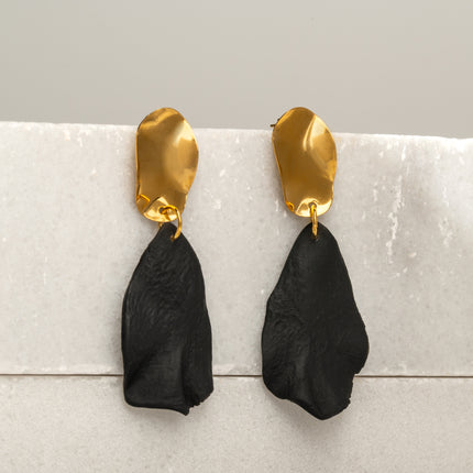 Handcrafted Melted Petal Gold Earrings featuring organic matte black drop shapes with fluid gold-tone tops, inspired by lunar petals, shadow work, and celestial transformation, available at Soul and Sage.