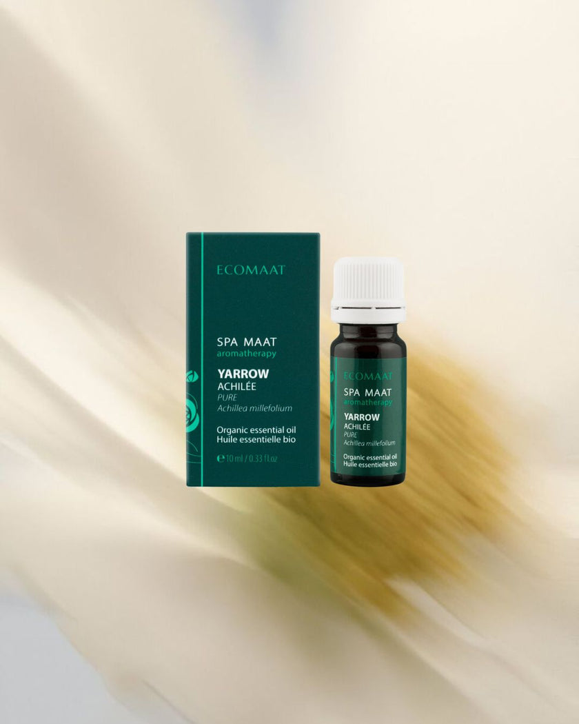 100% certified organic Yarrow essential oil (Achillea millefolium) in a 10ml pharmaceutical-grade glass bottle, steam-distilled from wild yarrow flowers and stems.
