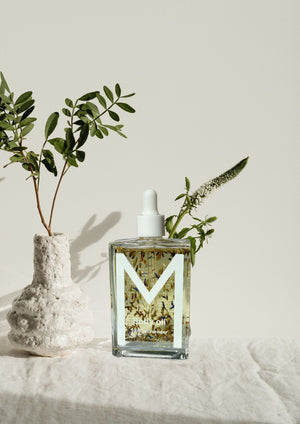 Bottle of Vanilla Lavender Night Muse Body Oil with lavender, vanilla, saffron, and passiflora oils, providing calming hydration, overnight skin renewal, and soothing care for body and spirit