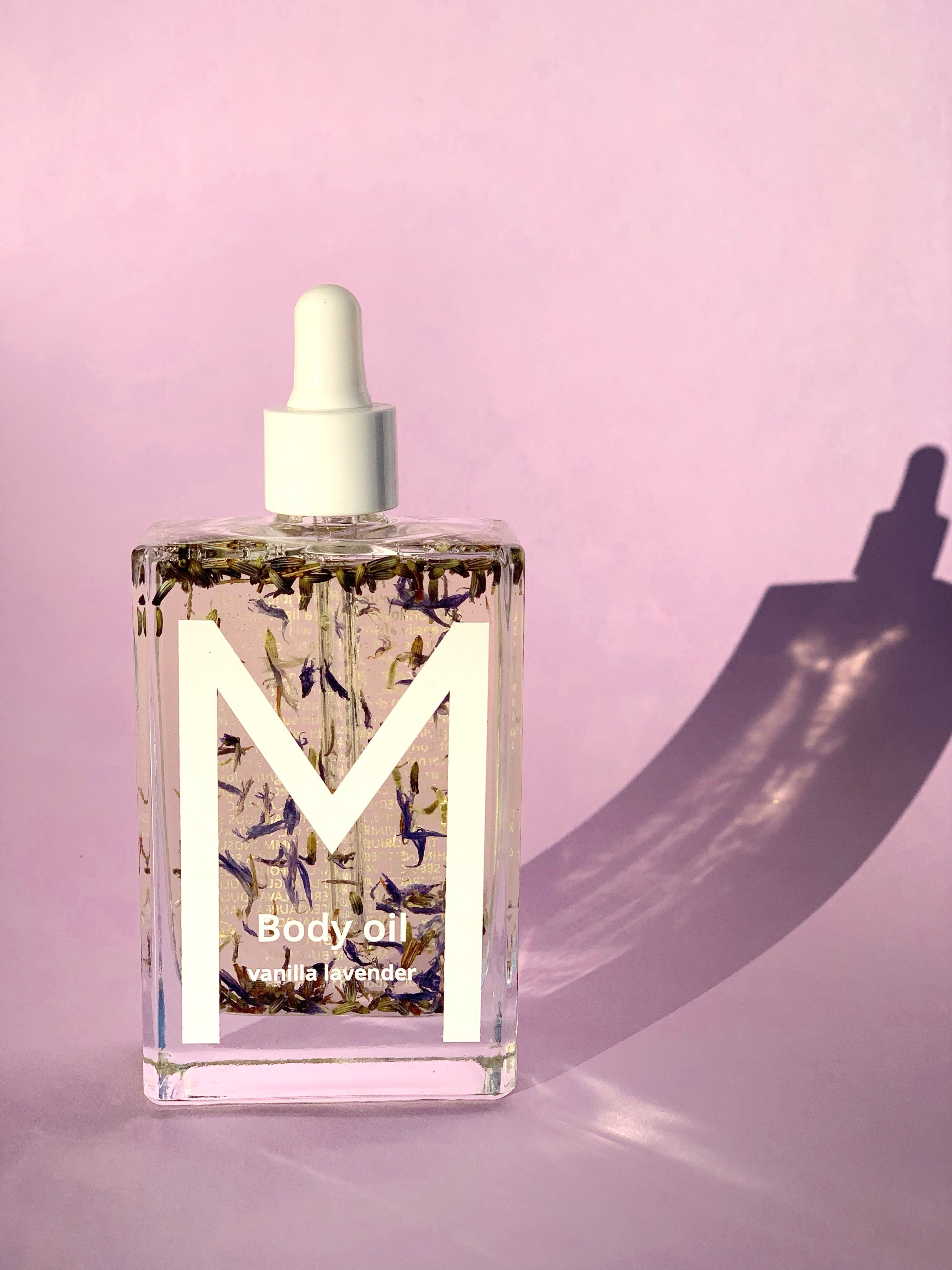 Bottle of Vanilla Lavender Night Muse Body Oil with lavender, vanilla, saffron, and passiflora oils, providing calming hydration, overnight skin renewal, and soothing care for body and spirit